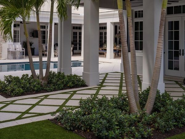 Backyard landscaping of pool patio with artificial turf