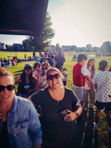 Group of people waiting for a pizza food truck that specializes in event catering in Chicago area