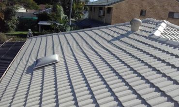 Finished Gray tiled rooftop under sunlight.