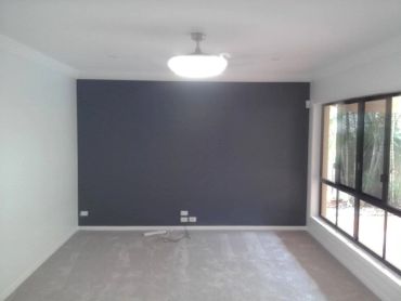 Empty room with dark accent wall