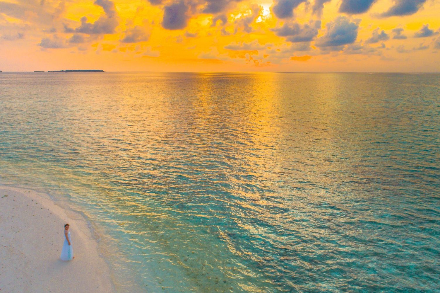 Woman on beach at sunset. Photo: www.dreamstime.com/person-beach-stock-image-image-free-116232221.