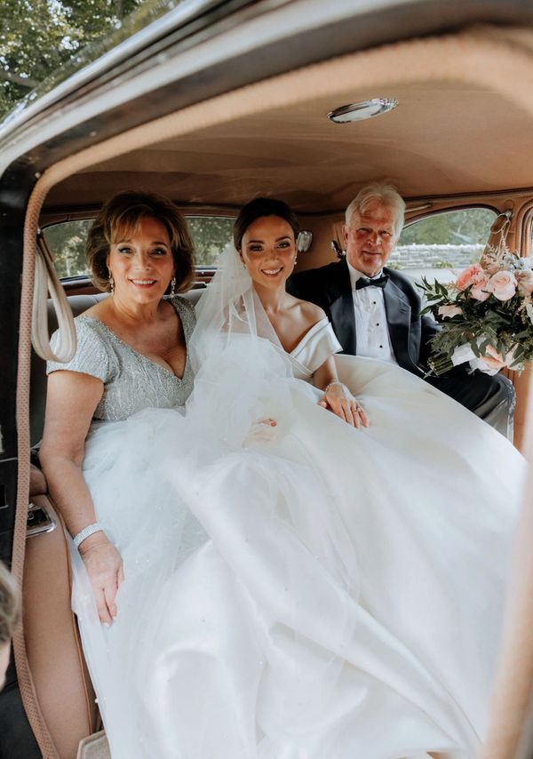 Bridal party in white wedding gowns