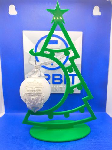 Green Christmas tree ornament holder with a Liverpool Football Club bauble.