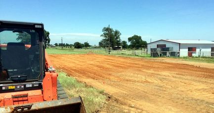 Excavating and grading a custom home building pad in Pilot Point, Texas.