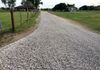 #2 After photo of road base and a topping of crushed limestone rock for a gravel driveway in Krum, Texas.