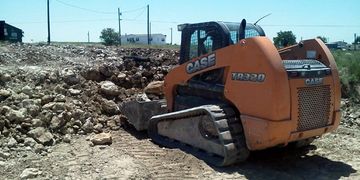Dit work and excavation for a retaining wall in Justin, Texas.