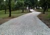 A fresh topping of crushed limestone rock for a gravel driveway in Argyle, Texas