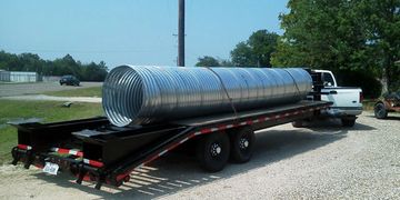 JNB delivering a tin horn corrugated steel culvert pipe in Tioga, Texas.