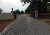 Regrading and repair of a gravel driveway in Pilot Point, Texas using flex base and a topping of crushed stone.