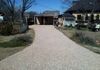 A new topping of crushed limestone to restore this gravel driveway in Justin, Texas.