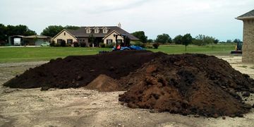 Topsoil and common fill dirt delivered to Krum, Texas by JNB Grading & Gravel.