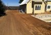 Finish grading and a drainage swale for a new home in Argyle, Texas.
