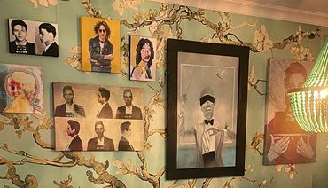 Gallery wall with Van Gogh wallpaper and various artwork of musicians.