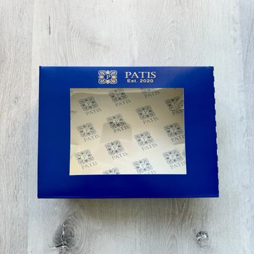 Blue bakery box with a custom printed lid and liner