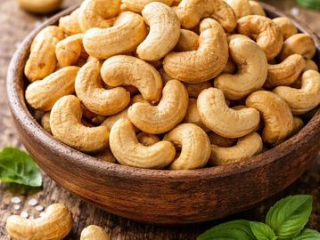 A bowl filled with roasted cashew nuts.