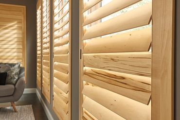 Close-up of wooden window shutters with natural grain.