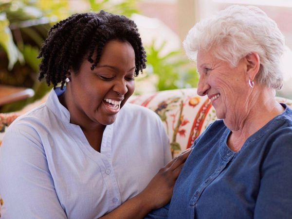 Practical Nurse providing companionship to an elderly client at home