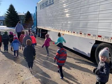 Kids learning about trucks and how food gets to store.