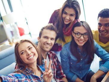 stock image of a group of students taking a selfie