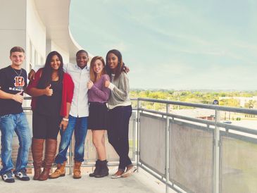 group photo of students on a large balcony