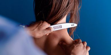 Houston massage therapist near me with cupping and graston technique scrapping athlete for recovery. Sports massage