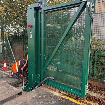 Commercial bifolding gate installation on security site