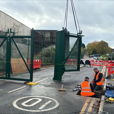 Commercial bifolding gate installation on security site