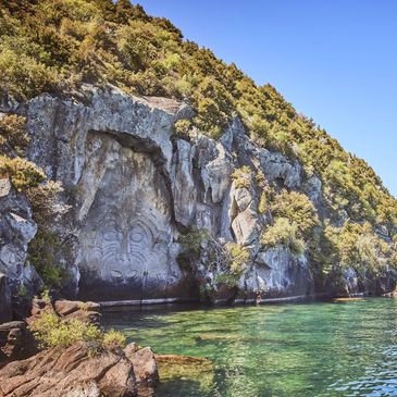 Ngātoroirangi Māori Carvings at Mine Bay on Lake Taupō, accessible by water from Okuta Bay Retreat