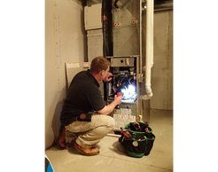 Master Inspector Daniel Goodine inspecting a furnace.