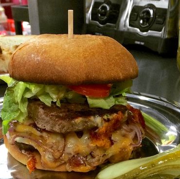 Burger with lettuce, tomato and pickle