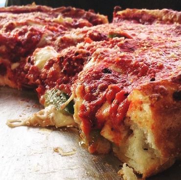 Anthony's Deep Dish has a crisp grain crust. The pizza sauce is on the top.