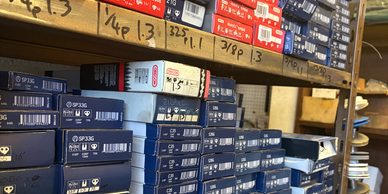 Shelves filled with labeled boxes of parts.