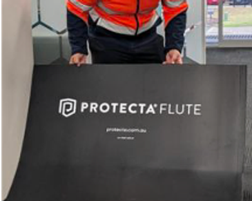 Person holding a black Protecta Flute board.