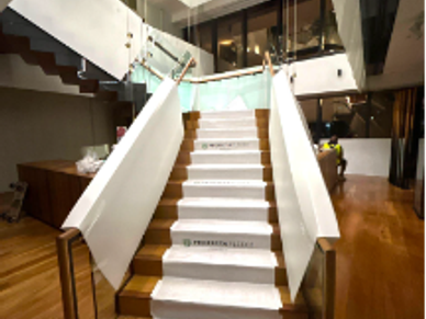 Staircase with white banners indoors at a modern building.