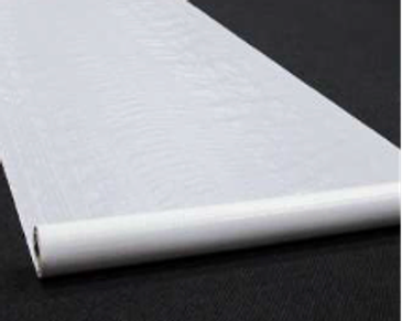 A rolled canvas or white fabric on a dark surface.