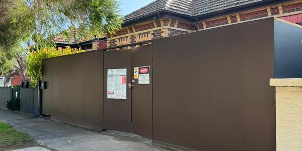 Construction fence around a building.