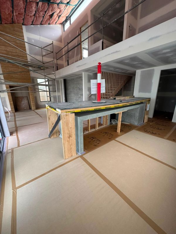 Interior of a house under construction with some construction materials.