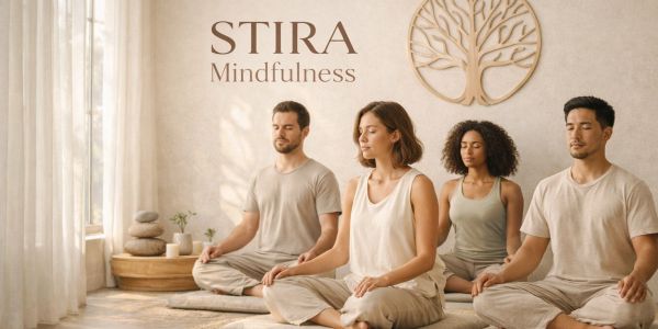 Four people meditating calmly in a serene, sunlit room with Stira Mindfulness branding.