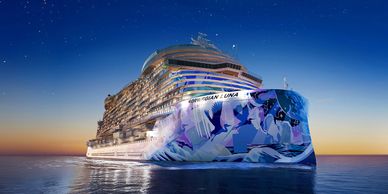 A large cruise ship with vibrant artwork sails at sunset under a starry sky.