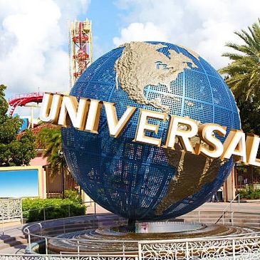 Iconic Universal Studios globe with bold lettering under a blue sky.