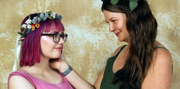Two women looking at each other affectionately.