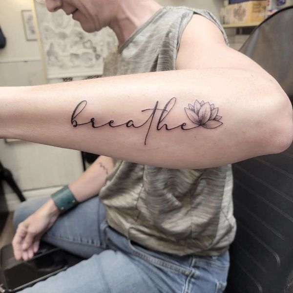 Script writing tattoo