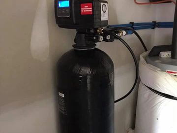 Whole House water softener with auto back washing. 