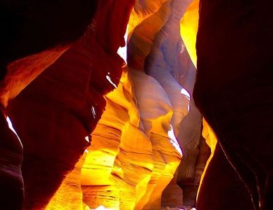 Brilliant gold colors as the sun lights up slot canyon wall