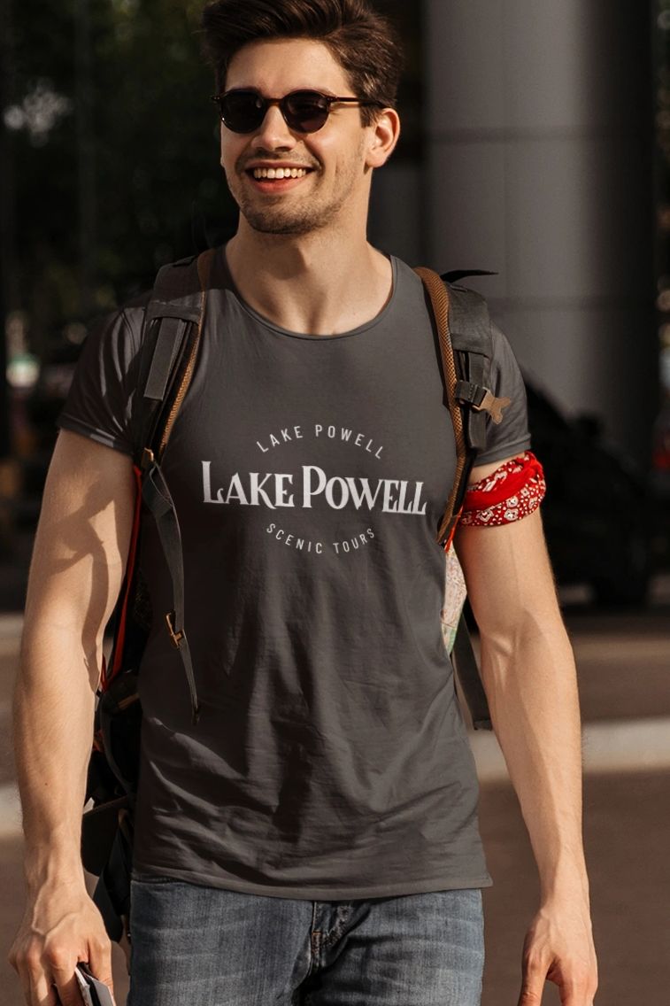 Man wearing Lake Powell Scenic Tours premium t-shirt while crossing street before tour
