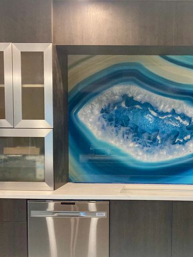Blue glass slab on kitchen backsplash