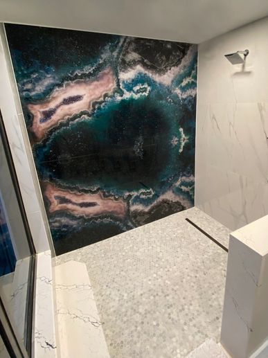 Ocean theme glass slab on shower wall