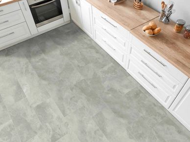 Gray 12x24 porcelain tile flooring in kitchen setting