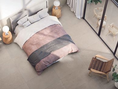 Concrete look tile flooring in bedroom
