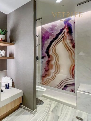 Amethyst glass slab on shower wall